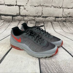 gray and red nike shoes